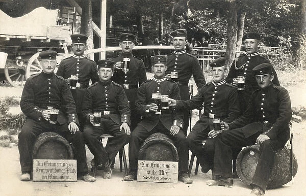 German soldiers with beer glasses and barrels