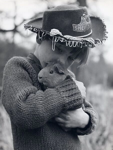 Gipsy boy with his pet guinea pig