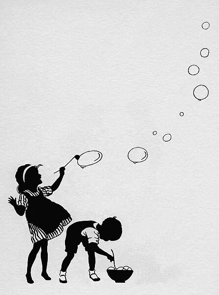 Girl & boy blowing bubbles