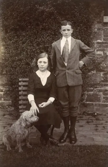 Framed Print : Girl and boy with a dog in a garden Framed Print : Girl and boy with a dog in a garden