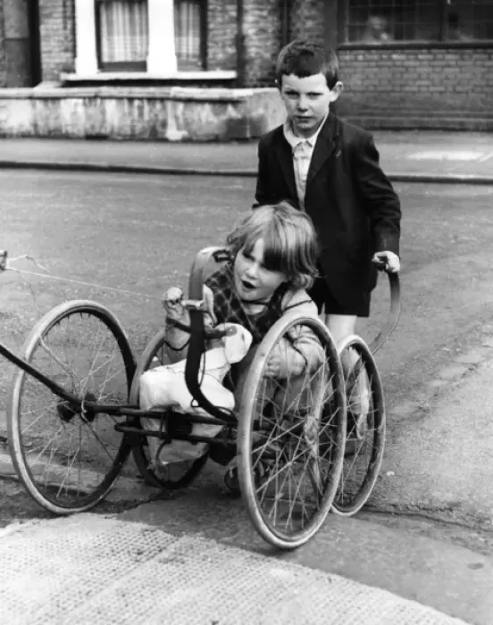 Framed Print : Girl and boy with pram wheels, Balham, SW London Framed Print : Girl and boy with pram wheels, Balham, SW London