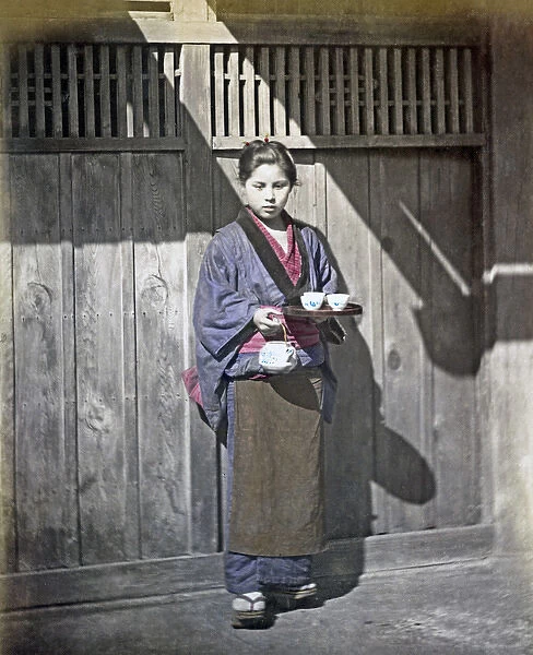 Girl carrying tea tray, Japan, circa 1880s