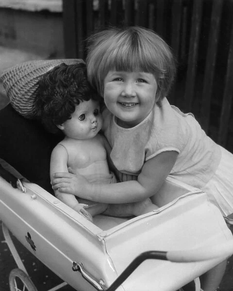 Girl with doll in pram, Balham, SW London