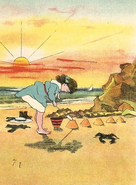 Girl making sandcastles at seaside