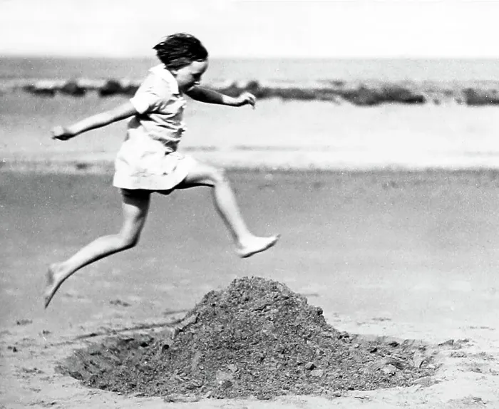 Framed Print : Girl playing on the beach, early 1900s Framed Print : Girl playing on the beach, early 1900s