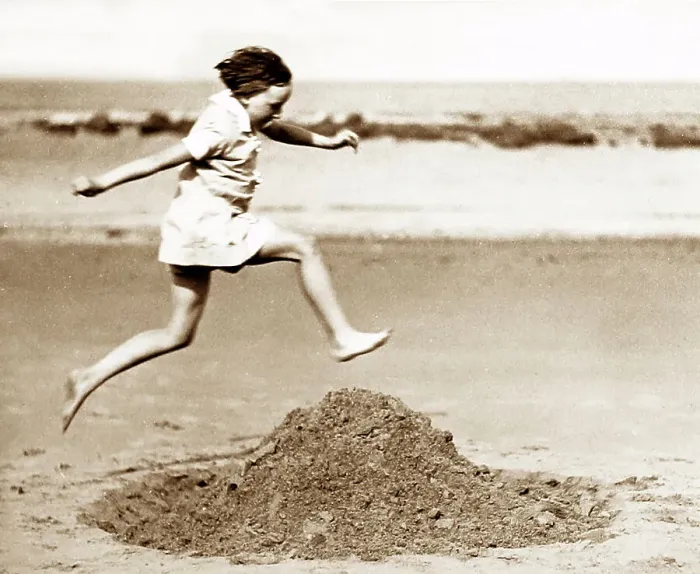 Framed Print : Girl playing on the beach, early 1900s Framed Print : Girl playing on the beach, early 1900s