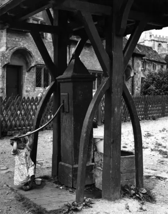 Framed Print : Girl Pumping Water Framed Print : Girl Pumping Water