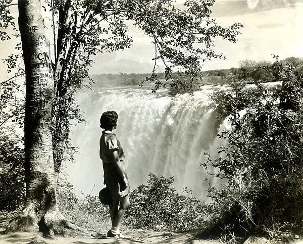 Girl standing by Victoria Falls, southern Africa