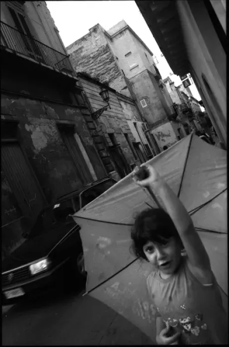 Framed Print : Girl in street with umbrella - Lecce, Italy Framed Print : Girl in street with umbrella - Lecce, Italy