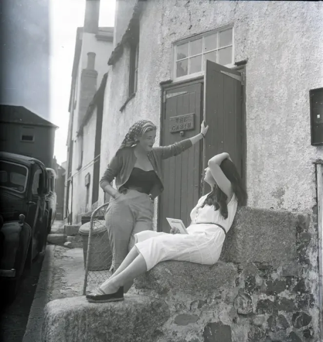 Framed Print : Girls chatting on the steps of The Cabin, St Ives, Cornwall Framed Print : Girls chatting on the steps of The Cabin, St Ives, Cornwall