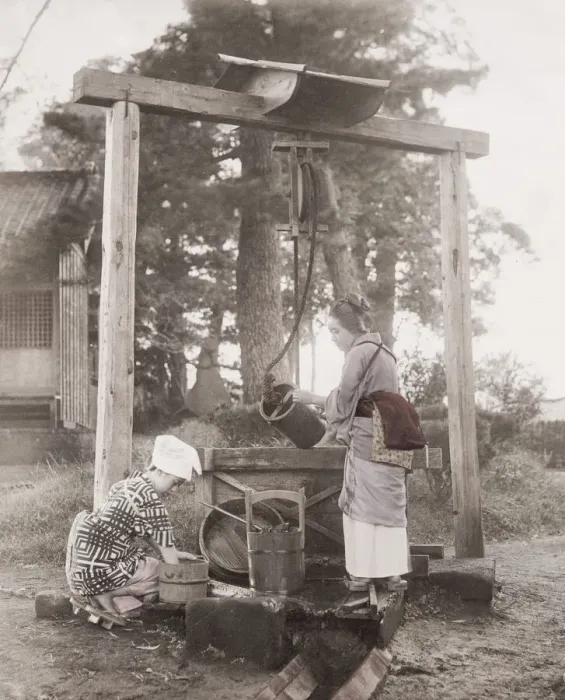 Framed Print : Girls drawing water from a well, with buckets, Japan Framed Print : Girls drawing water from a well, with buckets, Japan