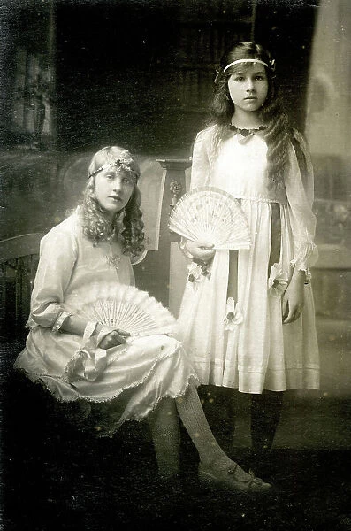 Two girls with fans