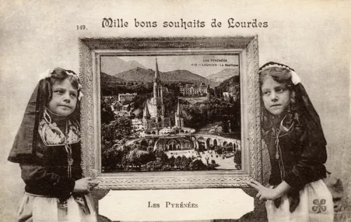 Framed Print : Two girls hold a picture of Lourdes, Pyrenees, France Framed Print : Two girls hold a picture of Lourdes, Pyrenees, France