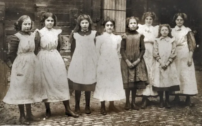 Framed Print : Girls outside a (clothes-making?) workshop Framed Print : Girls outside a (clothes-making?) workshop