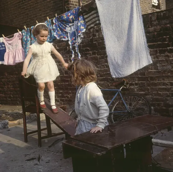 Framed Print : Two girls playing with planks, Balham, SW London Framed Print : Two girls playing with planks, Balham, SW London