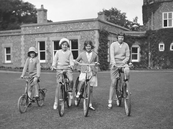 Four girls riding bicycles