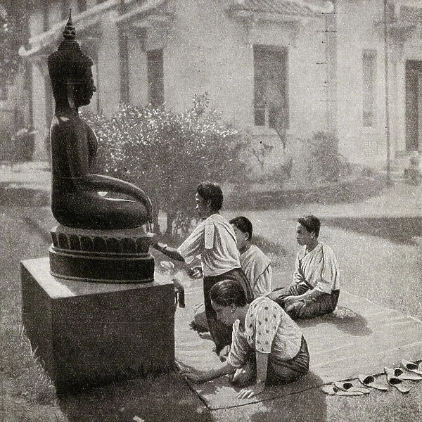 Giving flower offerings to Buddha, French Indochina