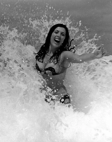 Glamour girl in the surf in Cornwall