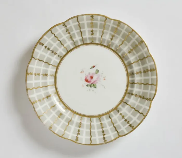 Framed Print : Plate. Glazed porcelain plate with scalloped edges Framed Print : Plate. Glazed porcelain plate with scalloped edges