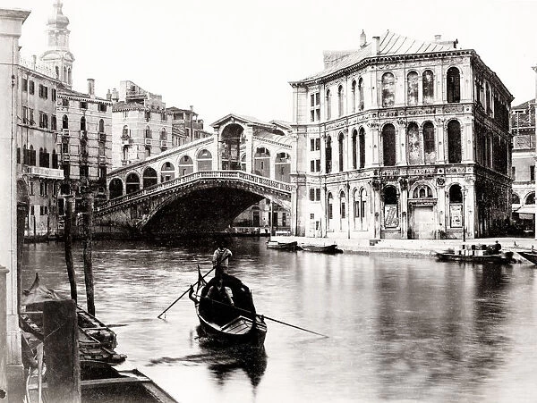 Gondola in the canal in front of the Rialto Bridge, Venice