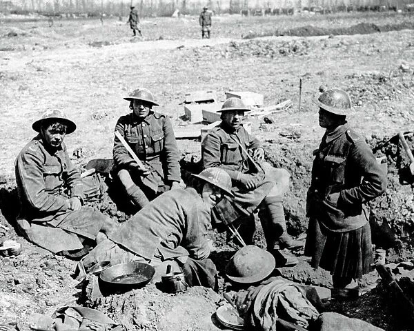 Gordon Highlanders resting in shell hole, WW1