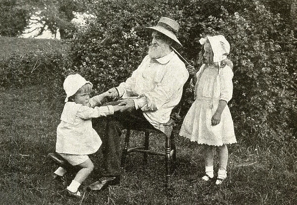 Grandfather and two children in a garden, England