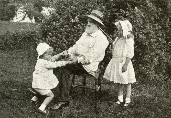 Framed Print : Grandfather and two children in a garden, England Framed Print : Grandfather and two children in a garden, England