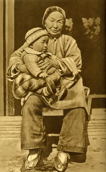 Framed Print : Grandmother holding her grandson, China, East Asia