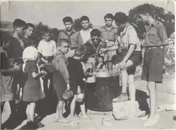 Framed Print : Greek boy scouts supplying water to children Framed Print : Greek boy scouts supplying water to children