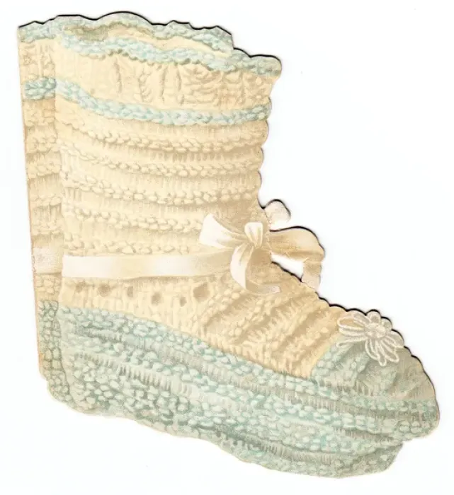 Framed Print : Greetings card, babys knitted shoe Framed Print : Greetings card, babys knitted shoe