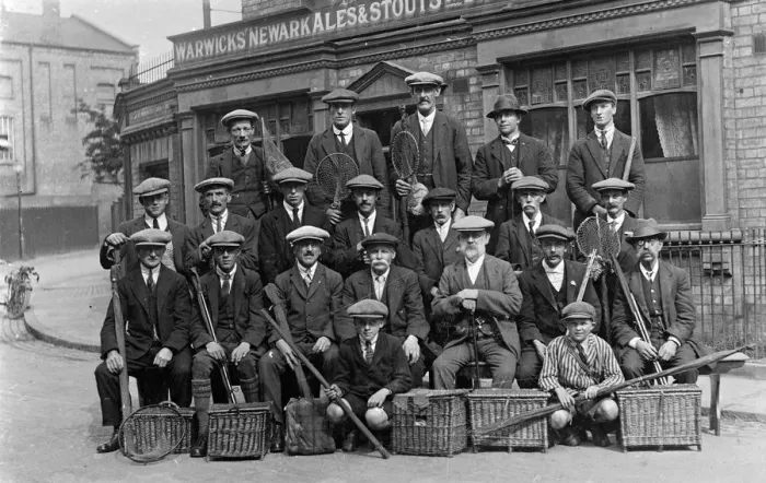 Framed Print : Group of fishermen with baskets and rods outside a pub Framed Print : Group of fishermen with baskets and rods outside a pub