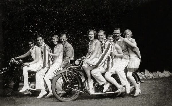 Group of fun-loving fashionable people on two vintage motorc
