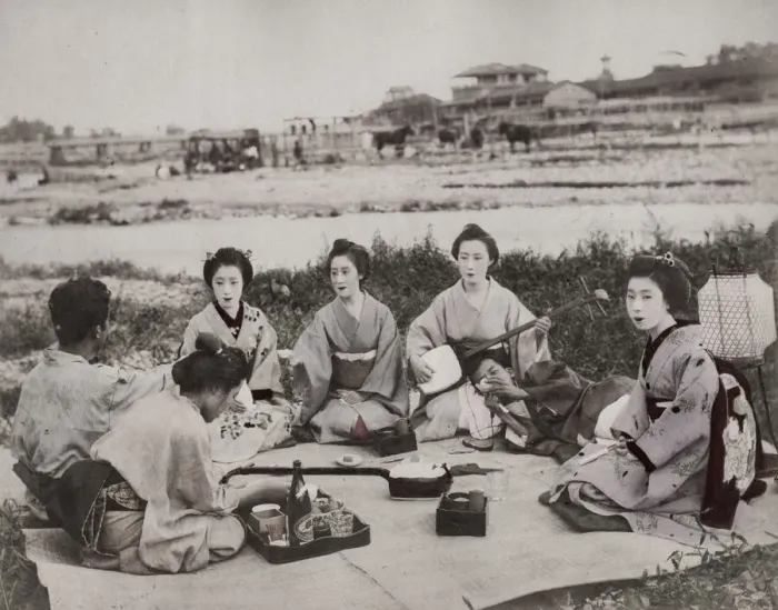 Framed Print : Group of geishas musicians on picnic with man, Japan Framed Print : Group of geishas musicians on picnic with man, Japan