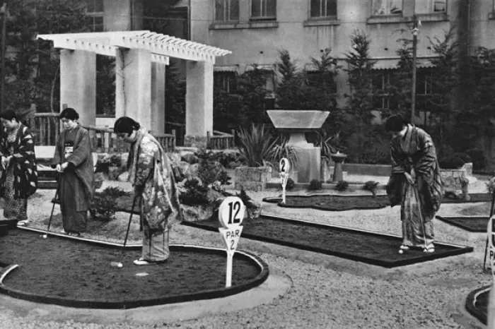 Framed Print : A group of Japanese women play miniature golf Framed Print : A group of Japanese women play miniature golf