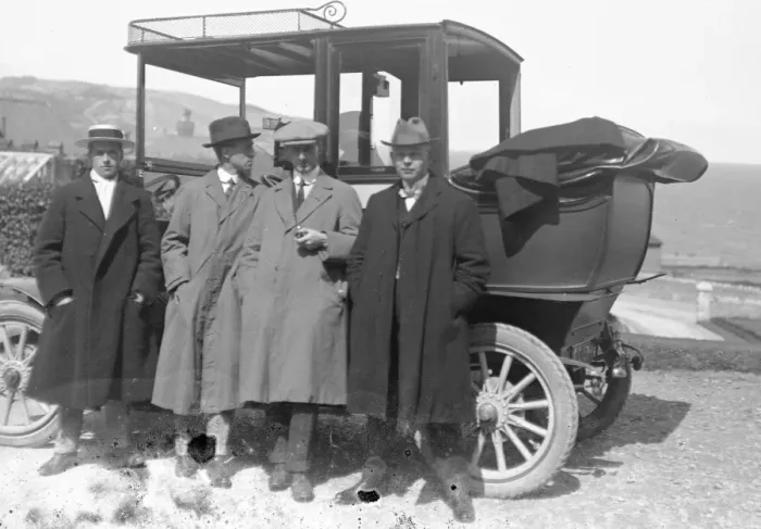 Framed Print : Group of men by a car Framed Print : Group of men by a car