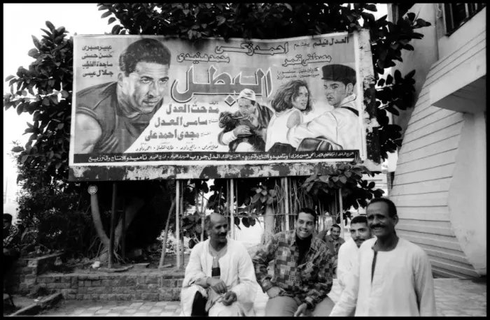 Framed Print : Group of men and film poster Alexandria, Egypt Framed Print : Group of men and film poster Alexandria, Egypt