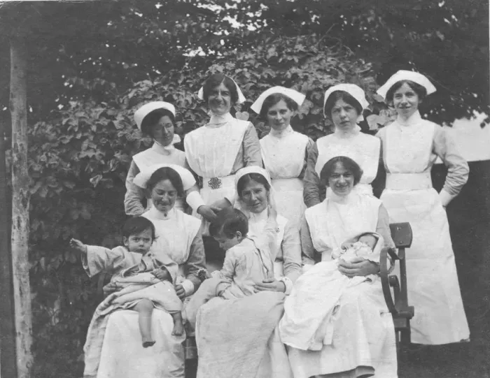 Framed Print : Group of nurses and children outdoors Framed Print : Group of nurses and children outdoors