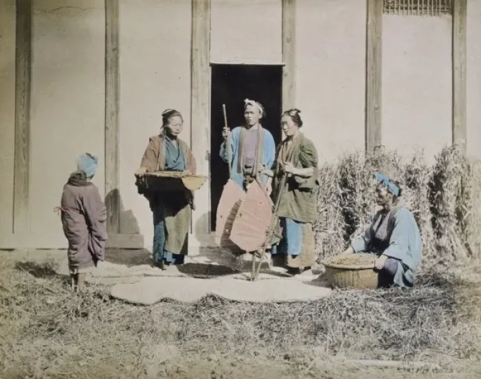 Framed Print : A group of people, possibly street vendors or farmers, two m Framed Print : A group of people, possibly street vendors or farmers, two m