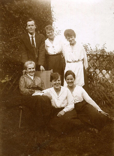 Group photo, family of six in a garden