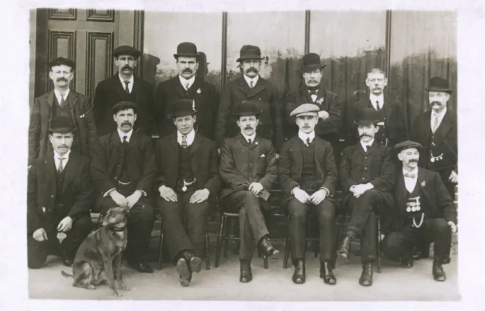 Framed Print : Group photo of men with a dog Framed Print : Group photo of men with a dog