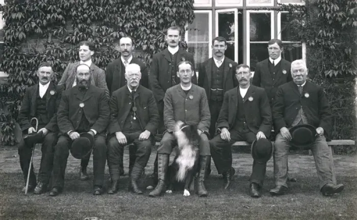 Framed Print : Group photo of men with a dog Framed Print : Group photo of men with a dog