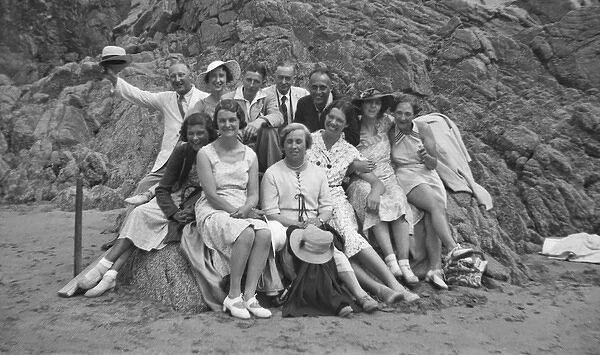 Group photo of people relaxing on a beach