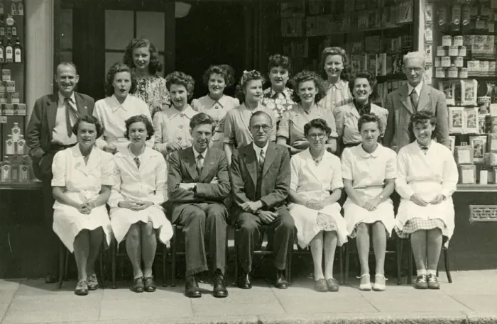 Framed Print : Group photo, staff outside a grocery shop Framed Print : Group photo, staff outside a grocery shop