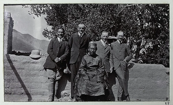Group photo, Tashi Lama with four men in western clothes, from a fascinating album which reveals new details on a little-known campaign in which a British military force brushed aside Tibetan defences to capture Lhasa, in 1904