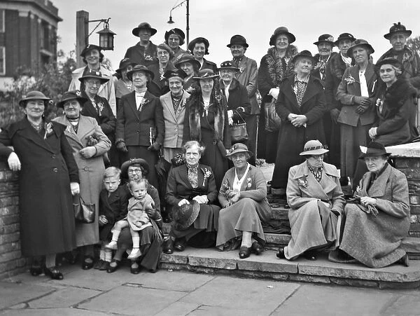 Group photo of women in hats and coats