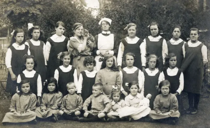 Framed Print : Group of schoolchildren with teacher, nurse and cat Framed Print : Group of schoolchildren with teacher, nurse and cat