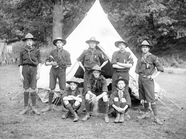 Group of scouts in front of a tent