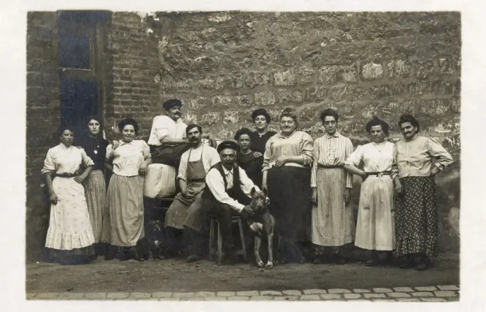 Framed Print : Group of working people with a dog, France Framed Print : Group of working people with a dog, France