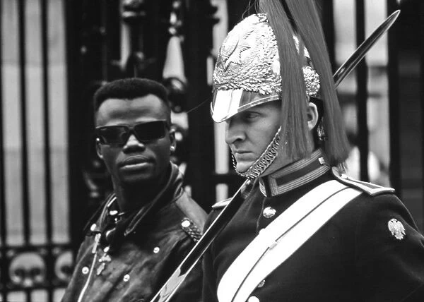 Guardsman with tourist, Whitehall, London