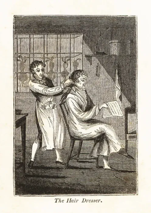 Framed Print : Hairdresser using a comb to brush a customer's hair in a barbe Framed Print : Hairdresser using a comb to brush a customer's hair in a barbe